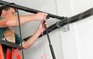 Garage door repair service in Maryland, showcasing a technician fixing a residential garage door.