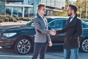 Screenshot 2024-10-19 at 15-47-32 Free Photo Photo of two smart elegant men which have a deal about car. They are doing handshake