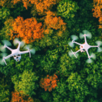 two-white-drones-flying-forest-with-orange-leaves_1084153-427.jpg (AVIF Image 626 × 417 pixels)