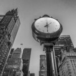 low-angle-view-clock-against-tall-buildings