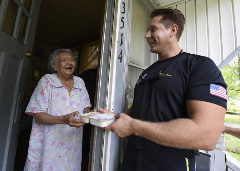 Sailor delivers Meals-on-Wheels to elderly and homebound residents.