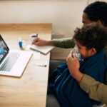 female-doctor-talking-via-video-call-father-who-is-giving-inhaling-therapy-his-son-home_637285-10597