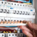 man-electrical-technician-working-switchboard-with-fuses-installation-connection-electrical-equipment-close-up_169016-5076-1024x655.jpg.bv