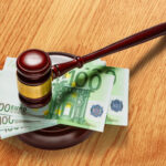 Wooden,Judge's,Gavel,And,One,Hundred,Euro,Banknotes