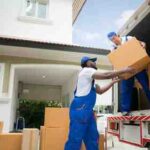 workers-unloading-boxes-from-van-outdoors-moving-service-customer-need-move-new-house (2)