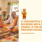 Arya Samaj Pandit Ji performing Griha Pravesh Havan ceremony with family in a decorated new home