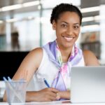 AdobeStock_78581372.-Woman-working-at-desk-768x512