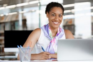 AdobeStock_78581372.-Woman-working-at-desk-768x512