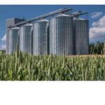 Industrial storage system with cement silo tank and bulk material handling equipment