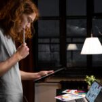side-view-woman-holding-tablet (1)