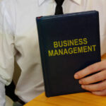 Conceptual hand written text showing business management