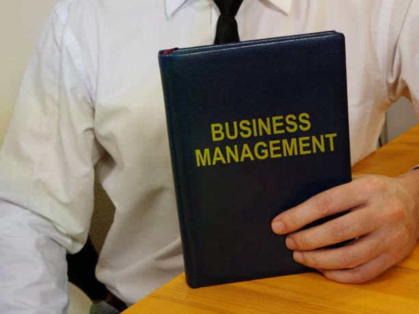 Conceptual hand written text showing business management