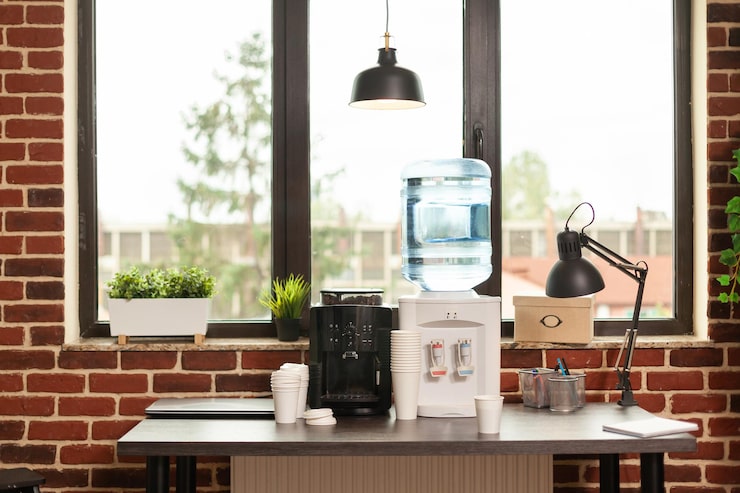 close-up-water-dispenser-coffee-machine-table-meeting-office-liquid-refreshment-people-working-modern-workplace-fresh-beverage-equipment-hydrate-break_482257-27404