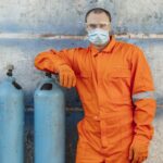 front-view-worker-uniform-with-face-mask-protective-glasses