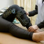 physiotherapist-stretch-exercises-patient-s-leg-rehabilitation-knee-injury_35666-339