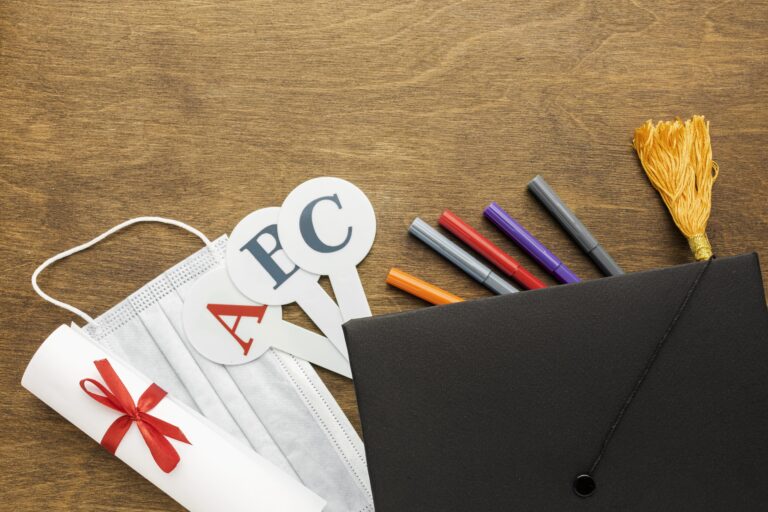 top-view-academic-cap-with-school-supplies-medical-mask