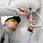 worker-repairing-water-heater (1)