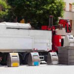 recycling-truck-picking-up-bin-city_11zon